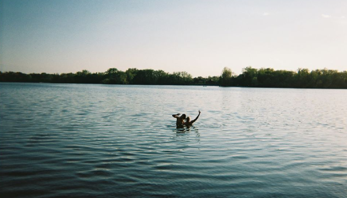 Student swimming in a lake while studying abroad