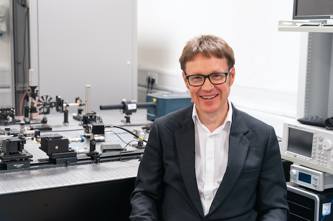 A portrait of Professor Douglas Paul in a lab environment