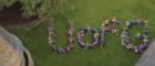 Image from above of people grouped together to spell UofG on the University quadrant grass