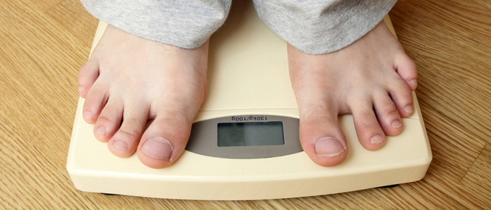 Photo of person standing on scales