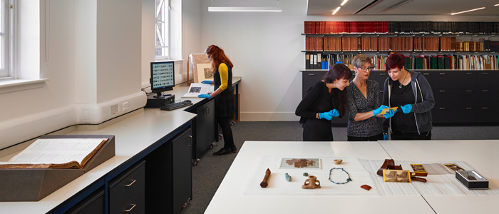 Researchers examining artifacts in Kelvinhall