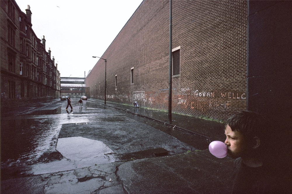 Photograph of boy in Glasgow street by Raymond Depardon