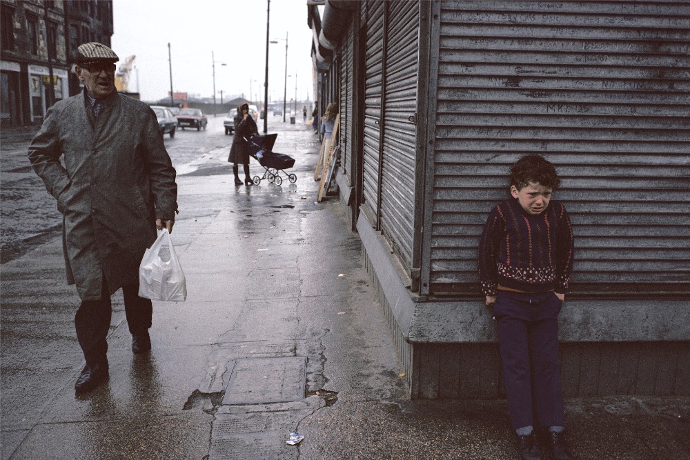 Photograph of man and boy in Glasgow street by Raymond Depardon