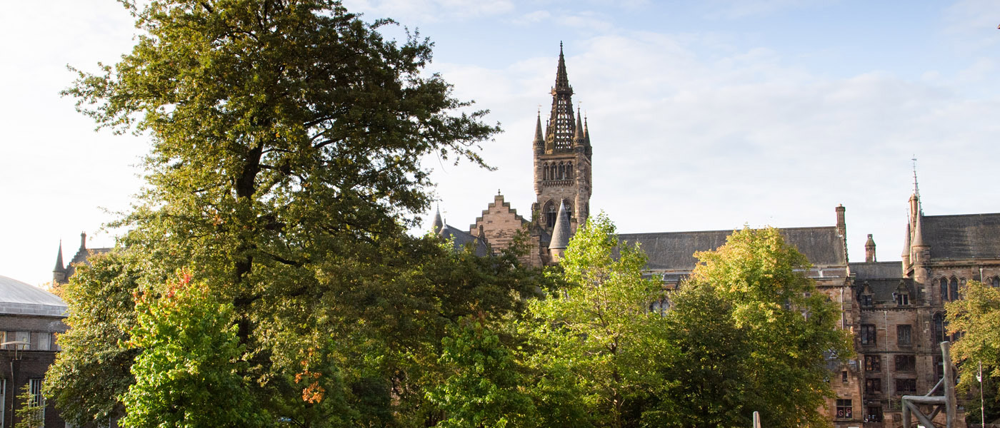 Main building of the University with trees in foreground