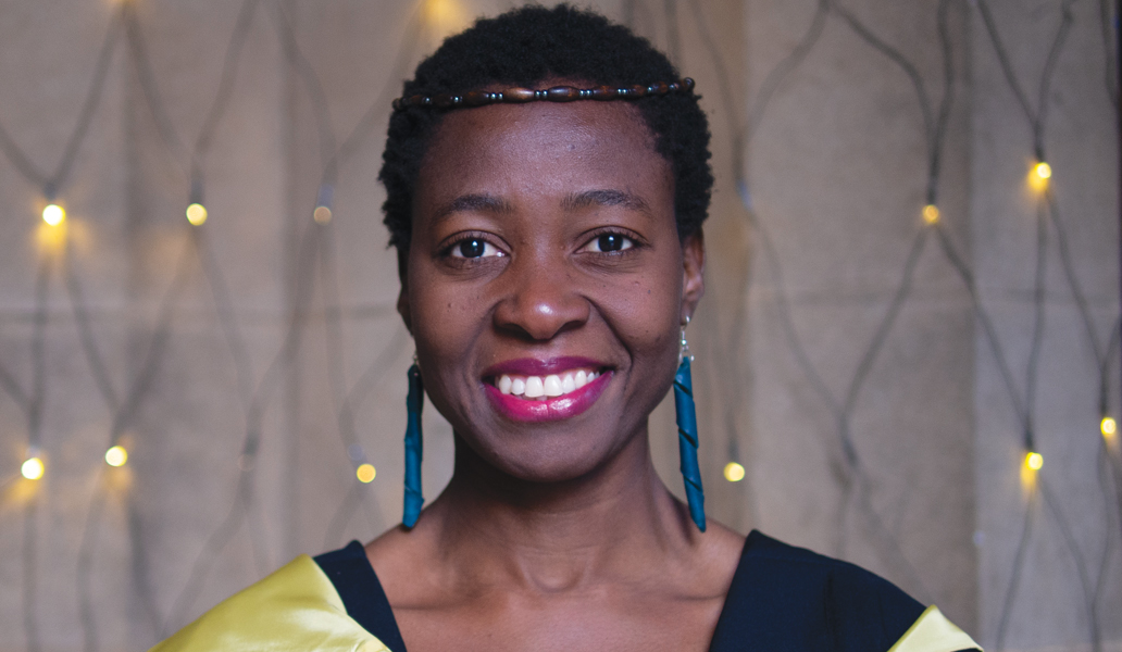 Head and shoulders shot of Eunice Ntobedzi in UofG cloisters at her graduation