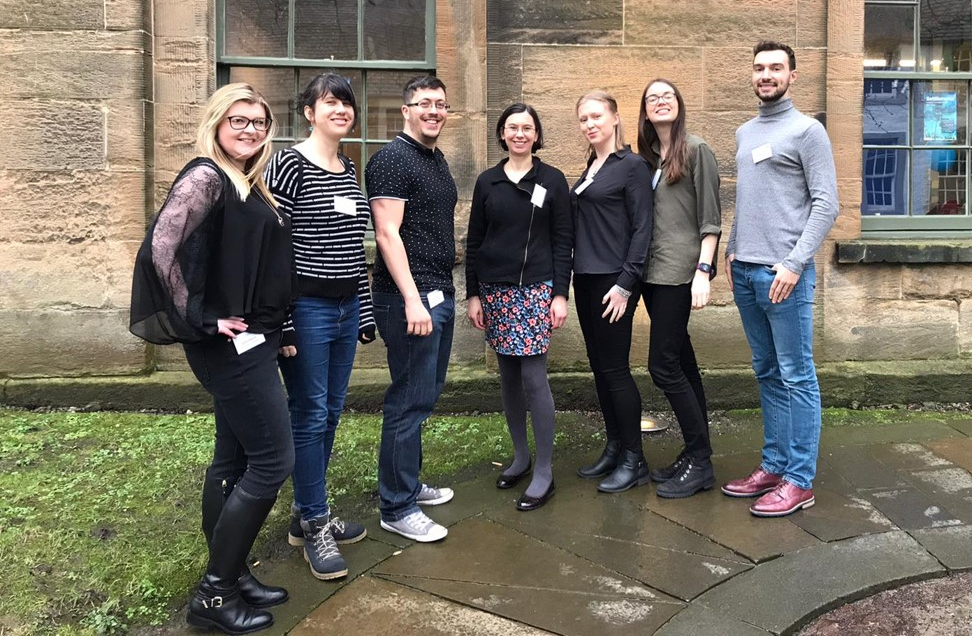 An image of the MacLeod Lab Group stood together in a row on campus, taken in February 2020