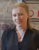 A head and shoulders shot of Dr Julie Worrell in front of a poster