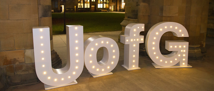 Large freestanding UofG letters in the Cloisters