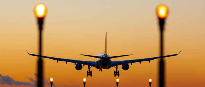 Plane landing in the sunset