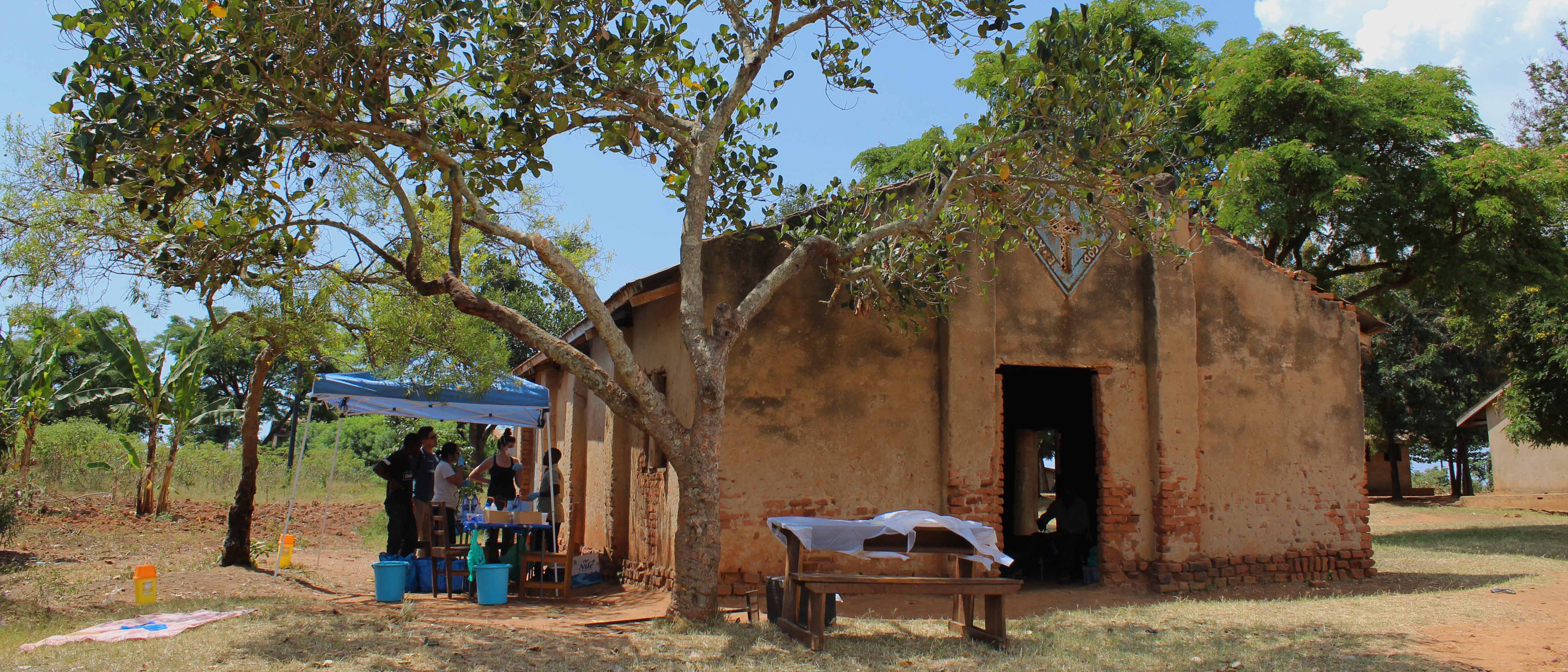 Sampling station set up under a tree beside an abandoned church in rural Uganda