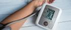 Stock image of an arm and blood pressure machine showing hypertension