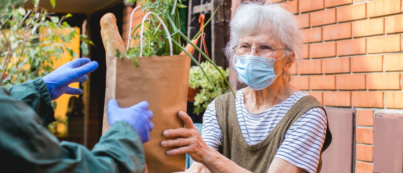 elderly lady receiving food delivery