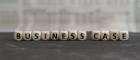 Dice spelling out the words business case in a line