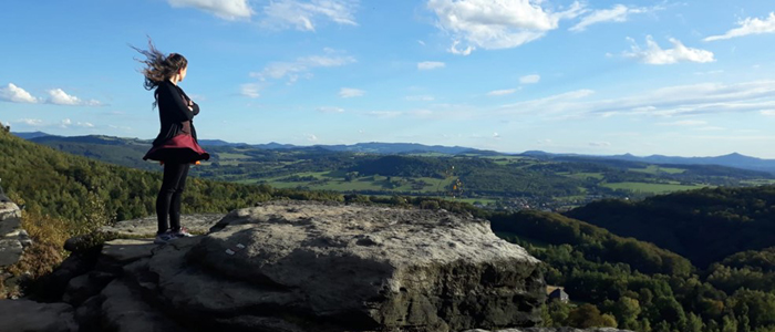 Photo of Jana Anderson standing on a hill