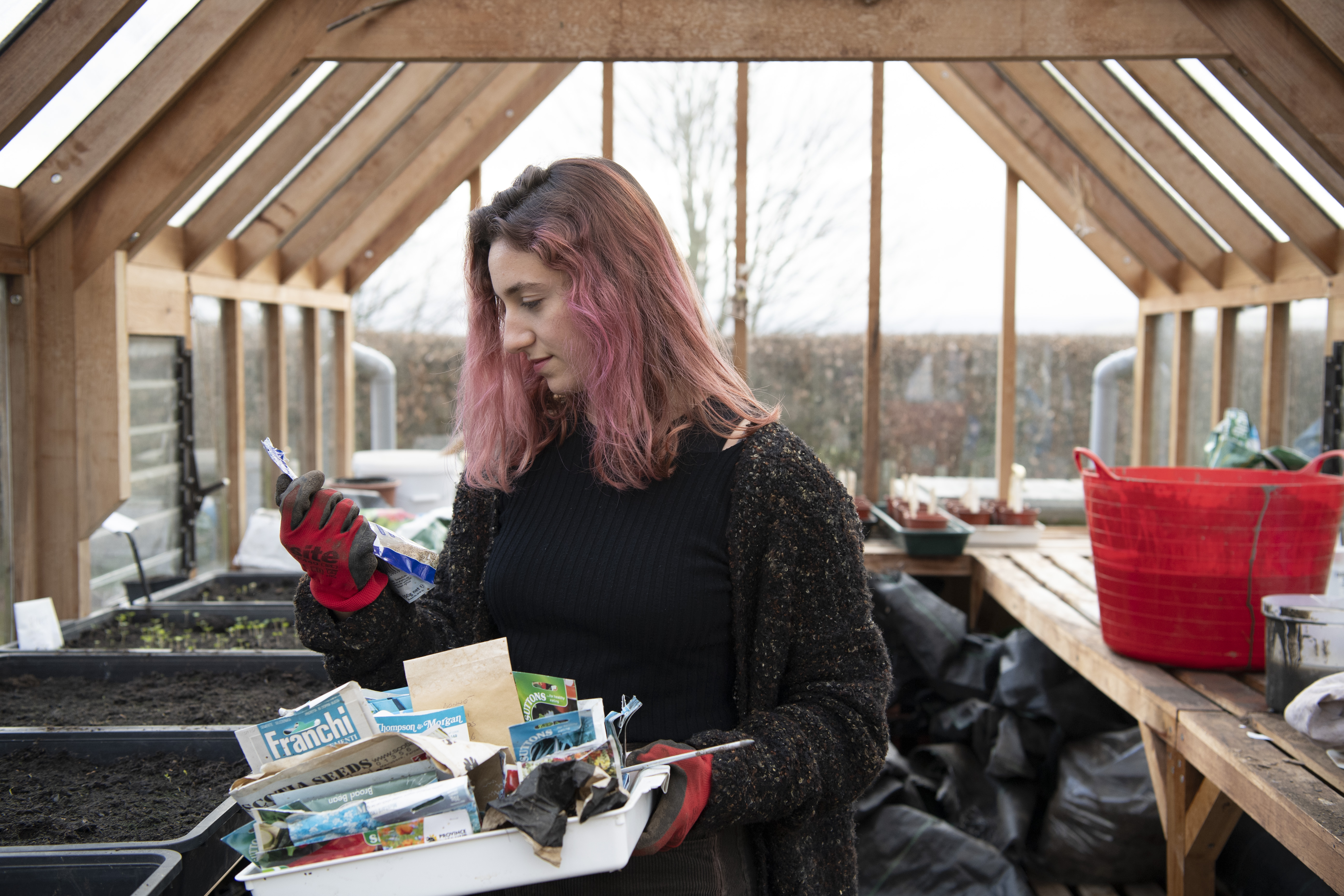 Teaching Garden - student in greenhouse