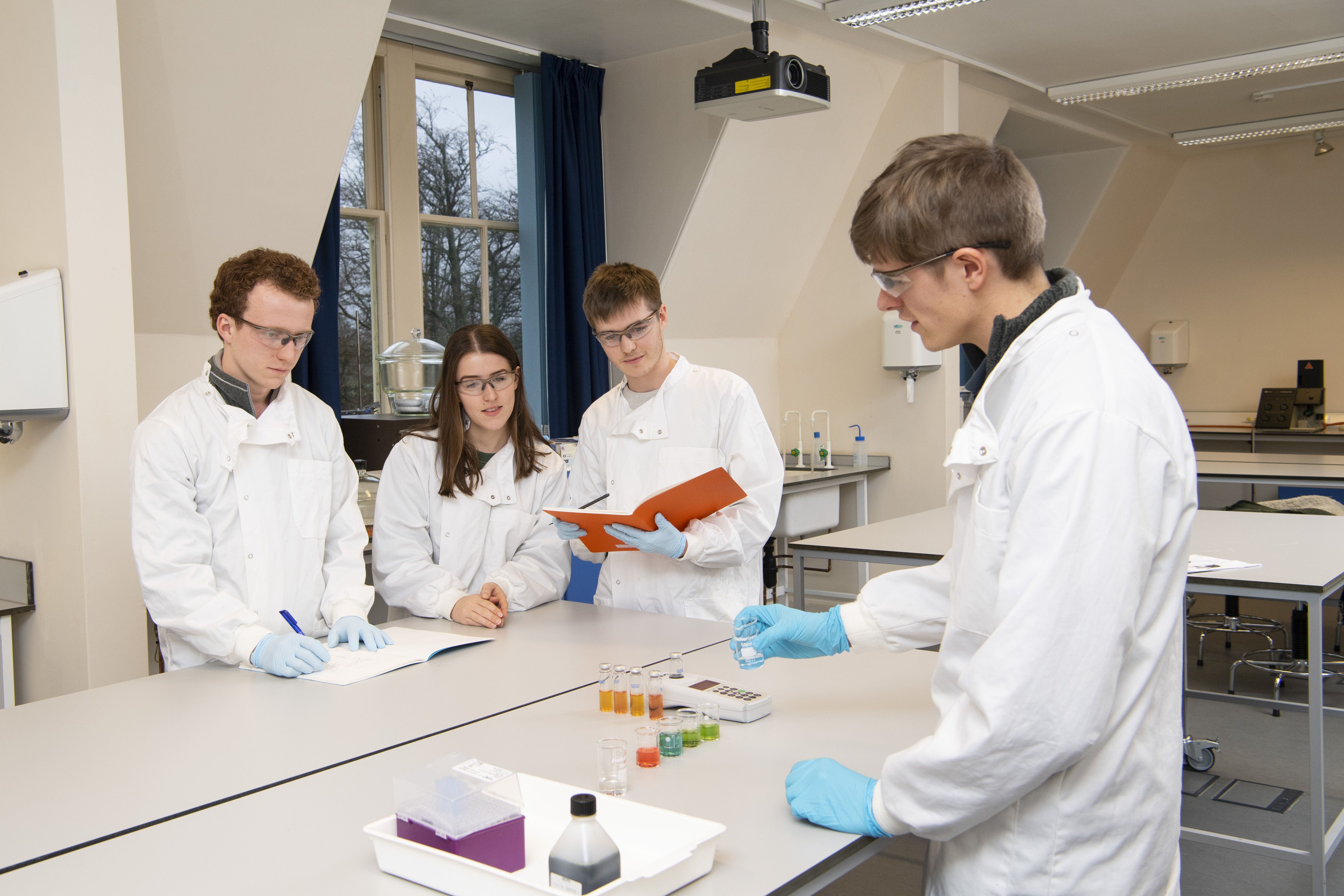 Lab - teacher demonstrating to students