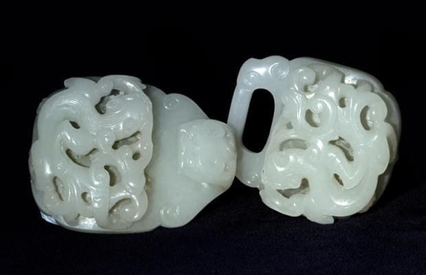 Jade; white nephrite belt clasp, with Qi dragons and lingzhi fungus; carved.
