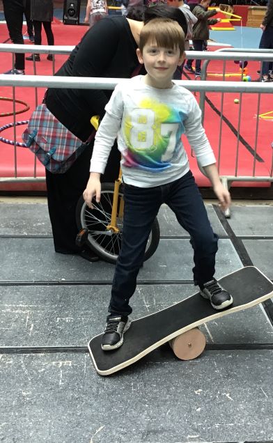 Young boy on a balance board