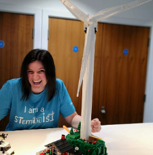 school teacher carrying out a wind turbine experiment