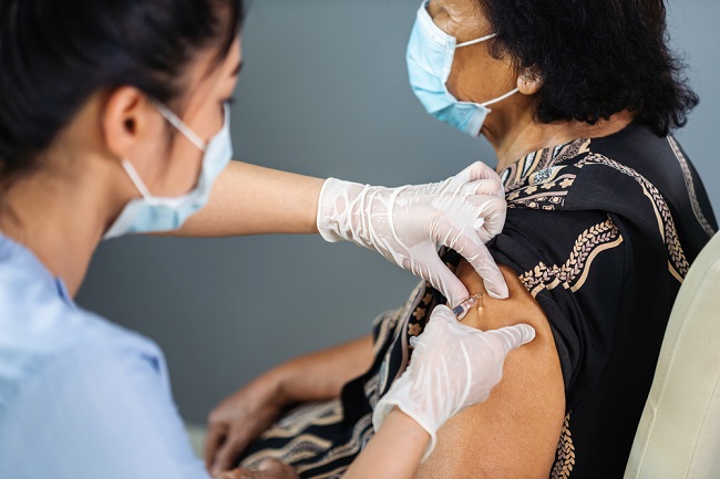 Woman being vaccinated