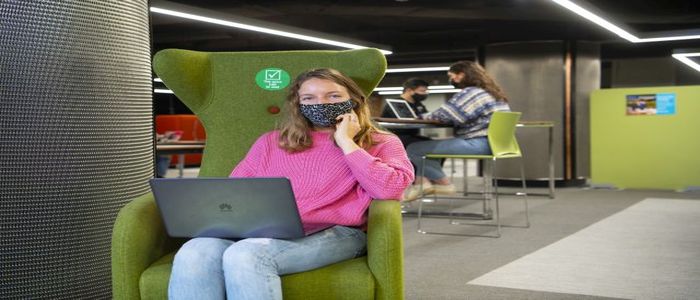 Girl wearing a mask in the main library