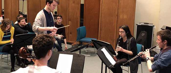 A student leads a composition workshop