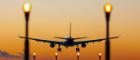 Plane landing into the sunset