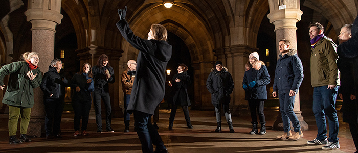 University of Glasgow Community Choir conducted by Dr Kathryn Cooper perform in the Cloisters