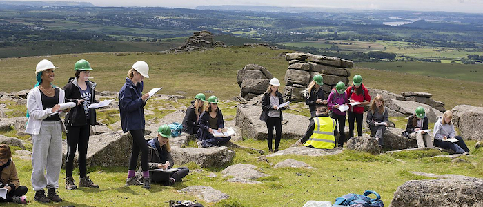 A group of young women outdoors on a geoscience field trip