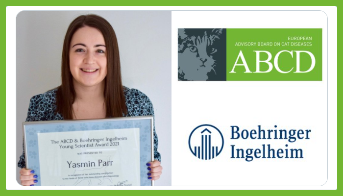 Centre for Virus Research's Dr Yasmin Parr holding the 2021 European Advisory Board on Cat Diseases (ABCD) Young Scientist Award, with ABCD and Boehringer Ingelheim Animal Health logos to the right..