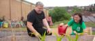 Dr Cheryl McGeachan of the School of Geographical and Earth Sciences and Glasgow Life youth worker Ally Harris tend to the Drumchapel High School vegetable garden 