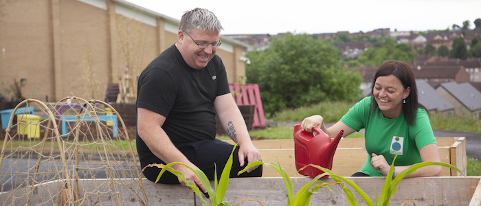 Dr Cheryl McGeachan of the School of Geographical and Earth Sciences and Glasgow Life youth worker Ally Harris tend to the Drumchapel High School vegetable garden 