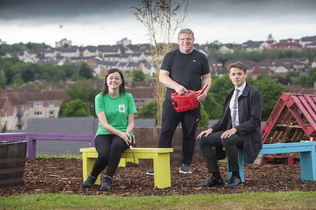 Dr Cheryl McGeachan of the School of Geographical and Earth Sciences and Glasgow Life youth worker Ally Harris and Steven Lamb of Drumchapel High School enjoy the garden built by pupils from Drumchapel High School with the support of the International Green Academy