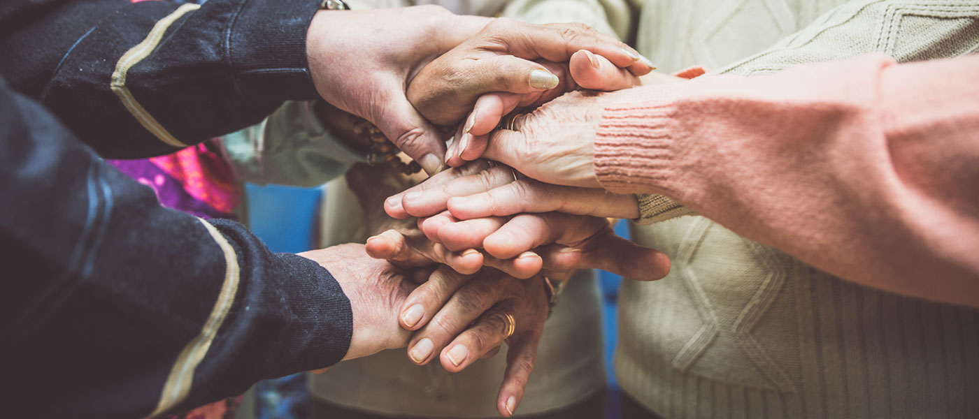 Image of overlapping adult hands