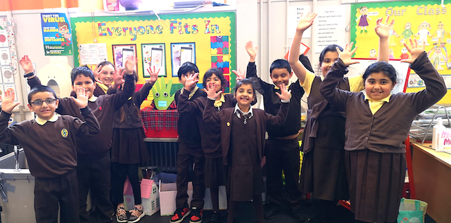 Pupils from St Bride's Primary School pose with handwashing robot WallBo