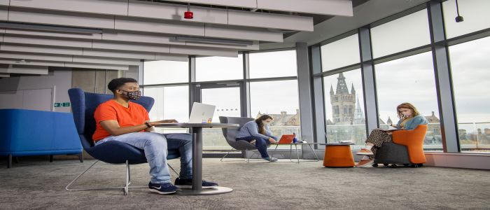 Students in mask studying in the James McCune Smith Learning Hub