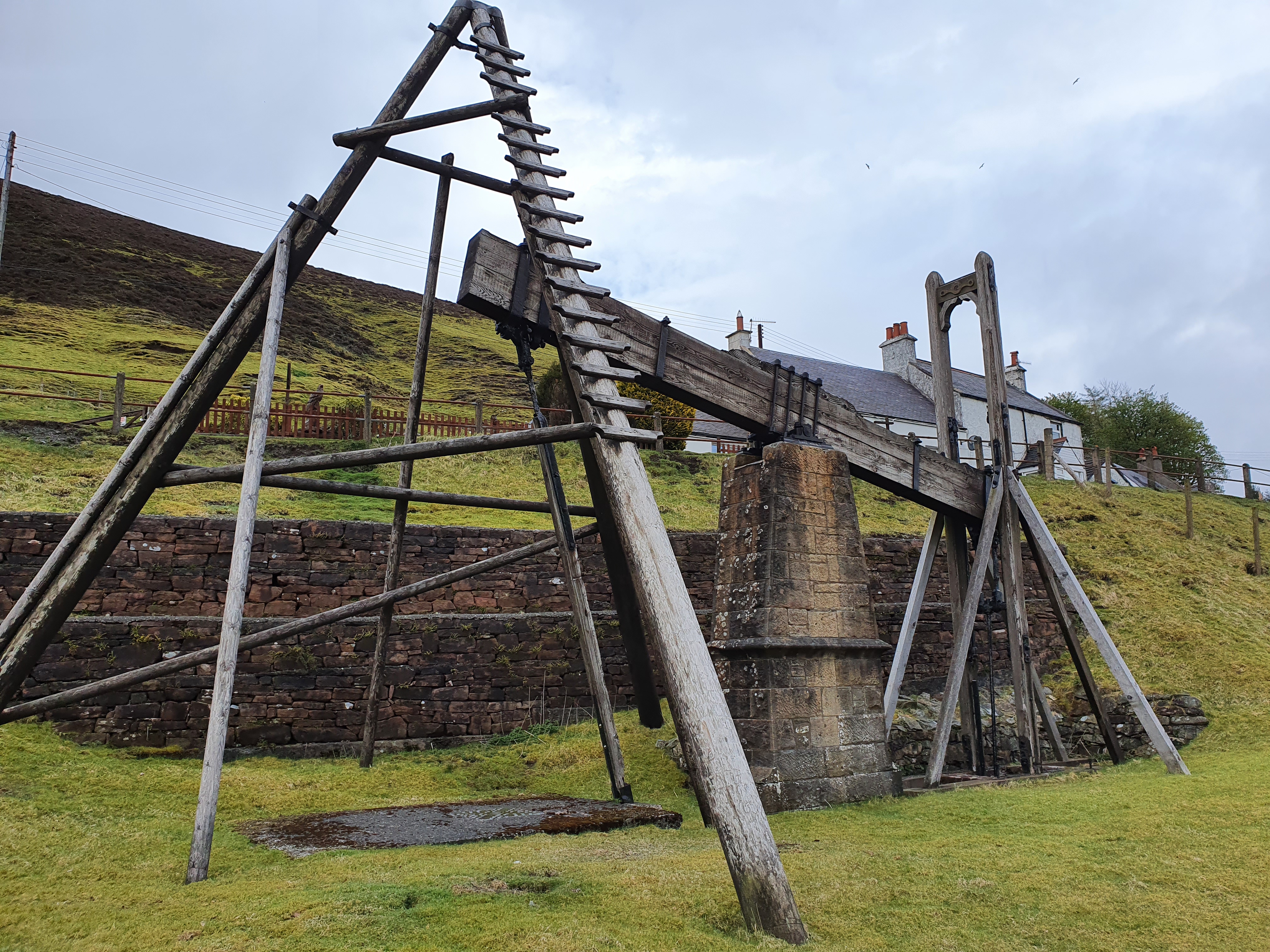 A picture of an old time water pump that can be found in the Wanlockhead museum of lead mining