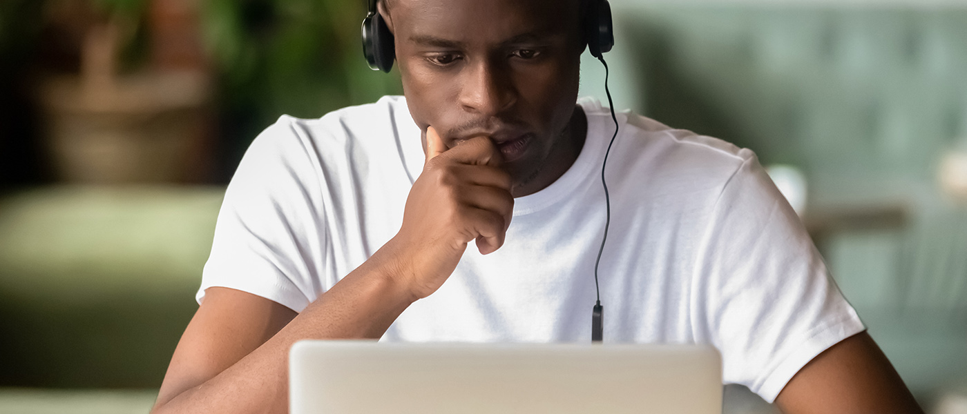 A student doing an online course on a laptop