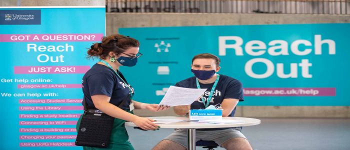 Two student Reach Out Team members in the Library