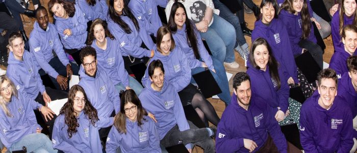 Peer support service team sitting in chairs