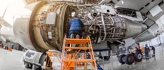 Engineer working on plane engine