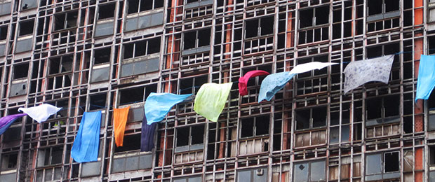 colourful sheets fluttering from a towerblock