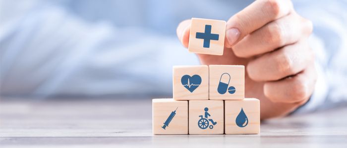 Image of building blocks with medical symbols