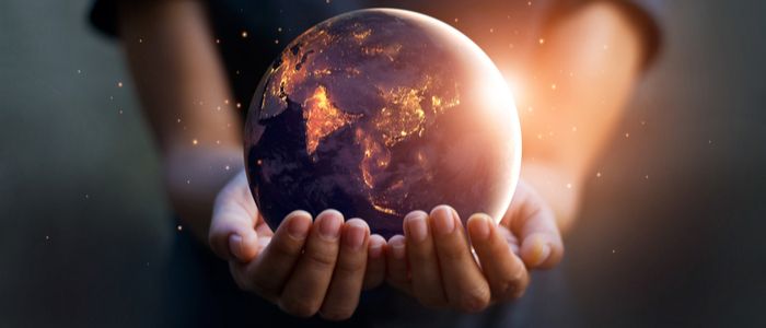 Image of a world globe being held in a person's hands