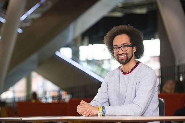 Dwayne Spirteri, a Research Associate at the University of Glasgow, who helped advise on the development of the James McCune Smith PhD Scholarship programme, is photographed in the University’s flagship James McCune Smith Learning Hub. Credit University of Glasgow.