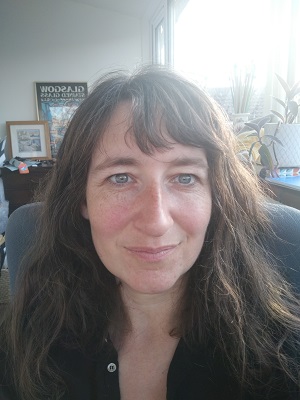 Head and shoulders image of a female against a window