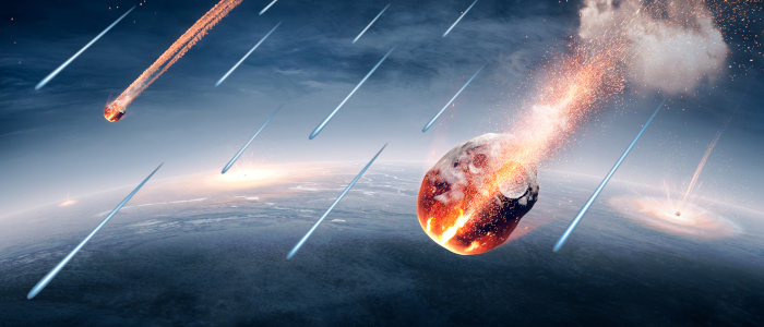 An artist’s impression of C-type asteroids and space dust raining down on the Earth early in its formation, carrying with them some of the water that formed the Earth’s oceans.