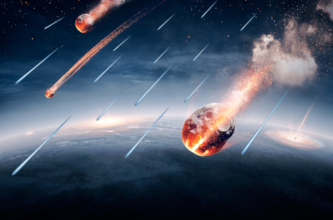 An artist’s impression of C-type asteroids and space dust raining down on the Earth early in its formation, carrying with them some of the water that formed the Earth’s oceans.