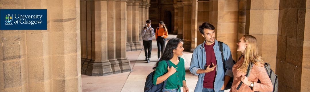 Students standing in the cloisters having a conversation