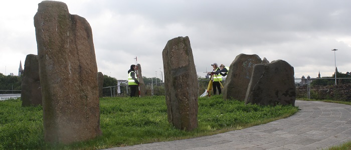 Students from UofG surveying the site of the new Sighthill Stones